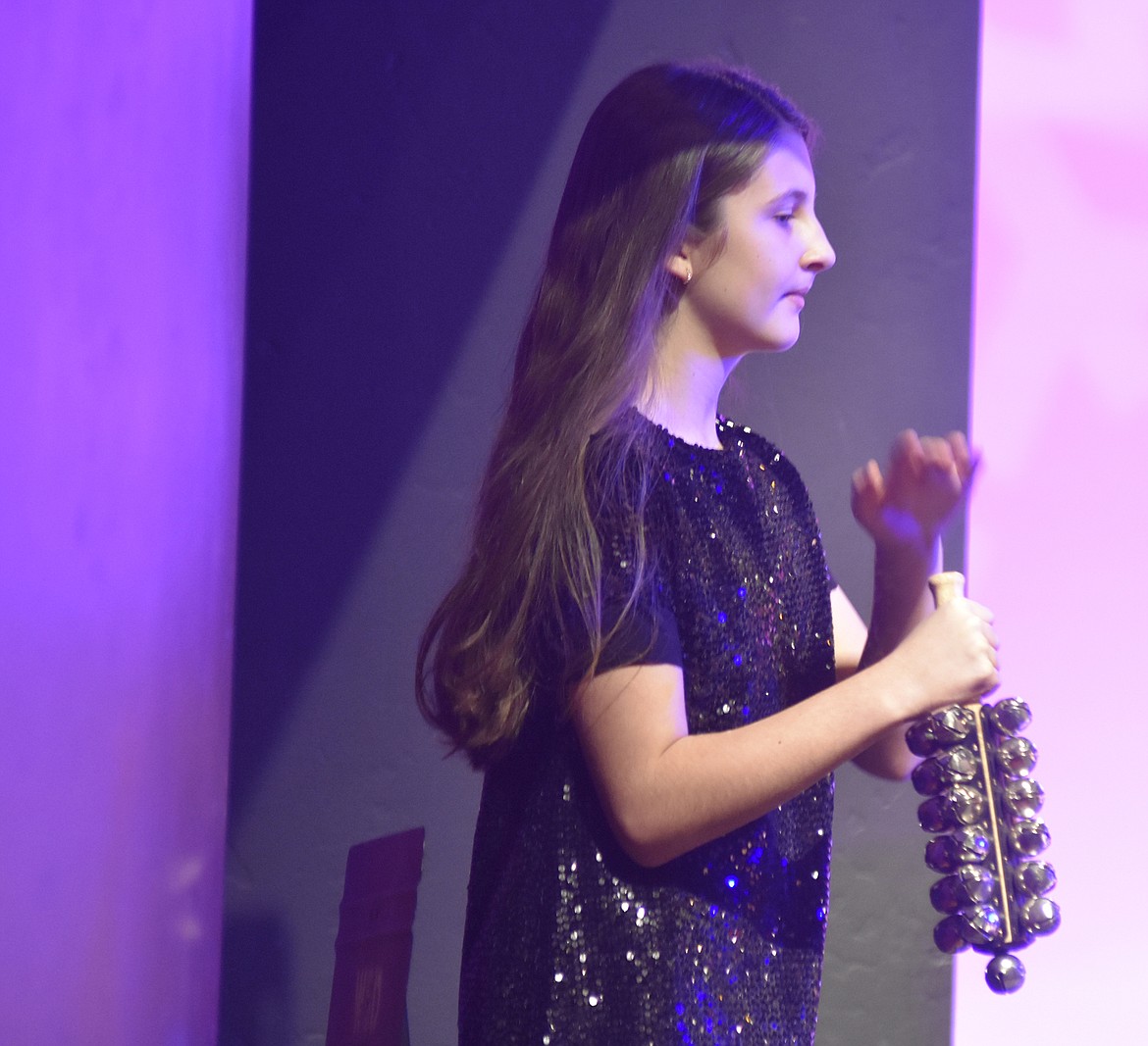 Sixth-grader Ariana Whitcomb plays the sleigh bells during &#147;iJingle&#148; during the Whitefish Middle School band concert at the Whitefish Performing Arts Center. (Heidi Desch/Whitefish Pilot)