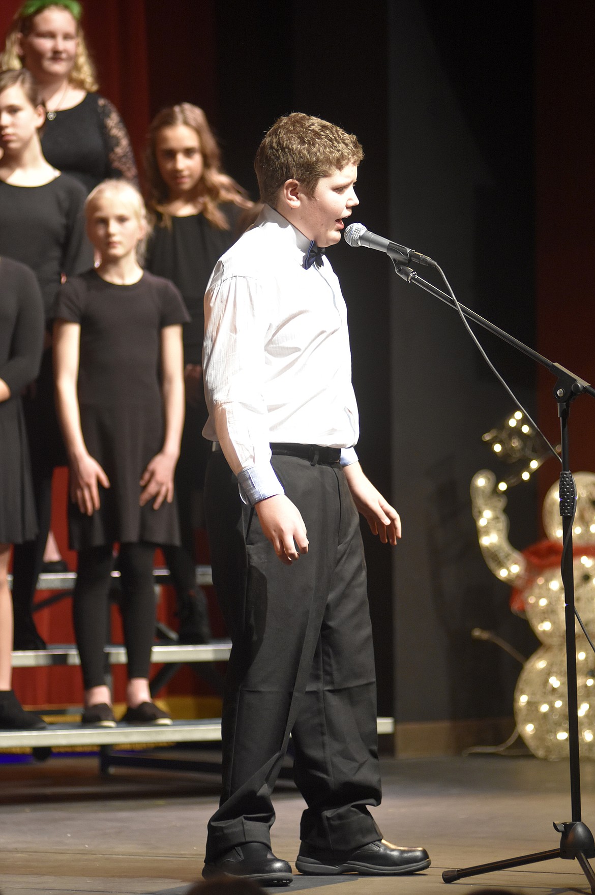 Whitefish Middle School student Cole Pickert sings a solo during &#147;Jingle Bell Rock&#148; during the middle school choir&#146;s holiday performance last week at the Whitefish Performing Arts Center. (Heidi Desch/Whitefish Pilot)