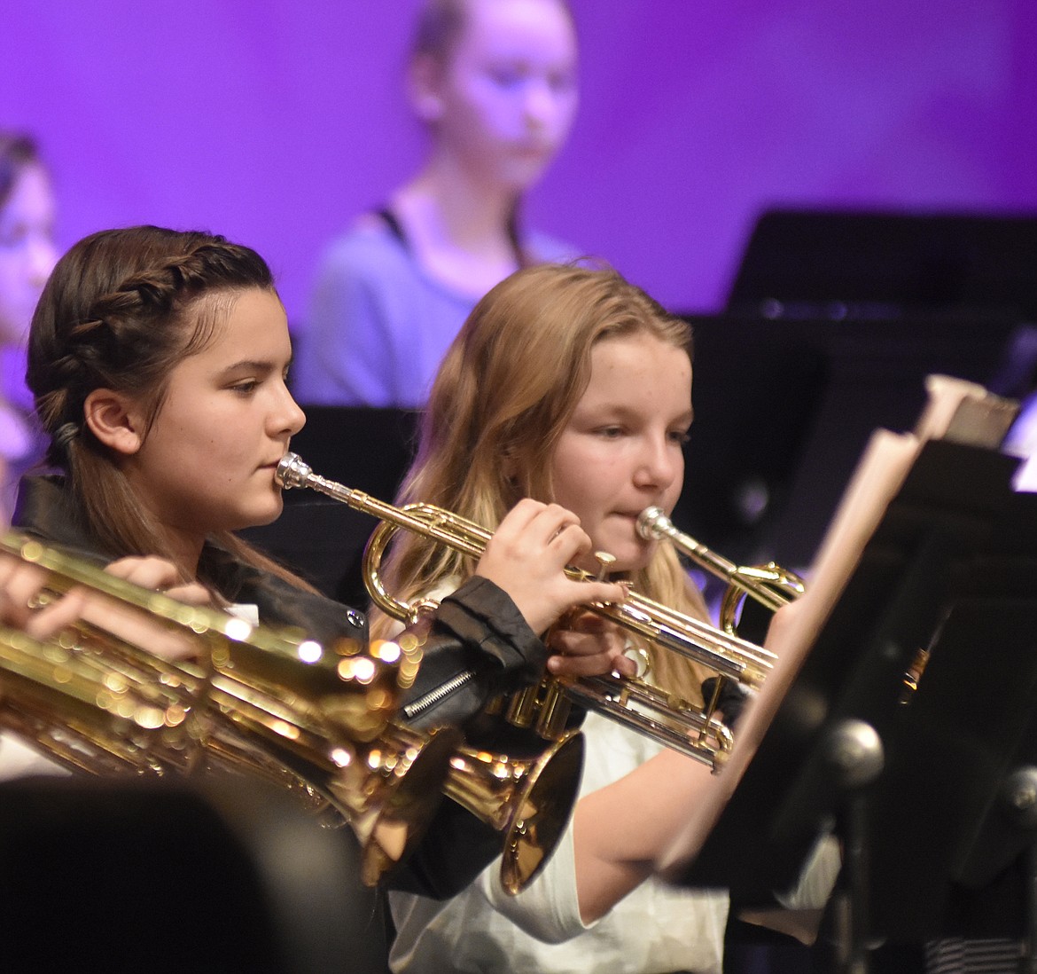 Seventh-graders Madison Hutson and Brady Boll play their trumpets during the Whitefish Middle School winter band concert recently. (Heidi Desch/Whitefish Pilot)