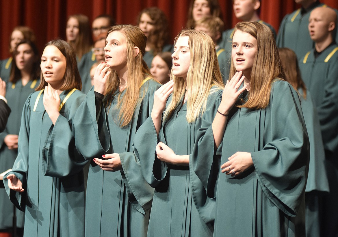 Whitefish High School choir members Jordan Doxey, Hailey Timlick, Annie Nixon and Faith Johnston sign &#147;Stille Nacht&#148; while also signing the song with the rest of the choir during the high school choir&#146;s performance. (Heidi Desch/Whitefish Pilot)