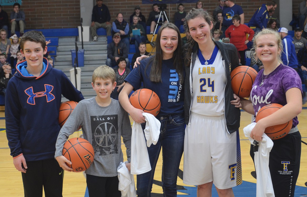 Honored on Dec. 20 during Thompson Falls-Plains basketball action as members of the 10,000 Shot Club for 2018 were, from left, Braxton Dorscher, Cael Thilmony, Ellie Baxter, Megan Baxter and Faith Frields. (Joe Sova/Clark Fork Valley Press)