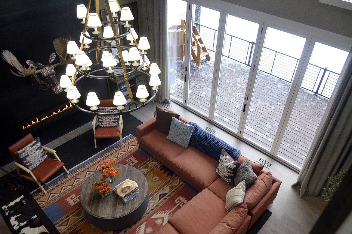 Looking from the second floor down to the living room. Windows in the living room open completely so during the summer the deck can become a full extension of the living space. (Heidi Desch/Whitefish Pilot)