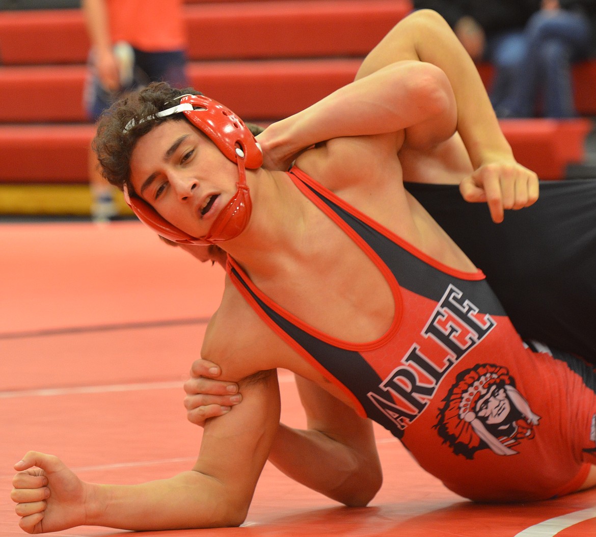 Arlee&#146;s Kanoa Palazzolo tries to escape a hold by Josiah Vanderwall of Plains/Hot Springs during a match in last Friday&#146;s Arlee Mixer. (Joe Sova/Lake County Leader)