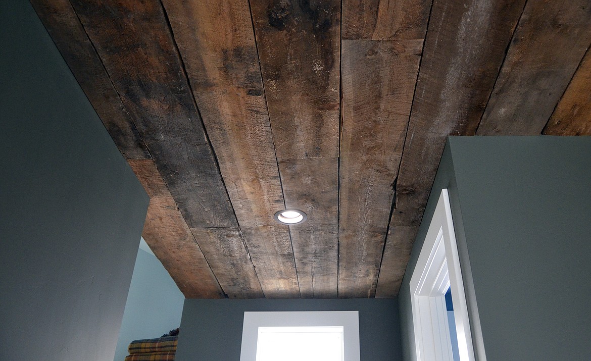 Wood for the ceiling in the master bathroom and dining room came from a barn that was torn down in Columbia Falls. (Heidi Desch/Whitefish Pilot)