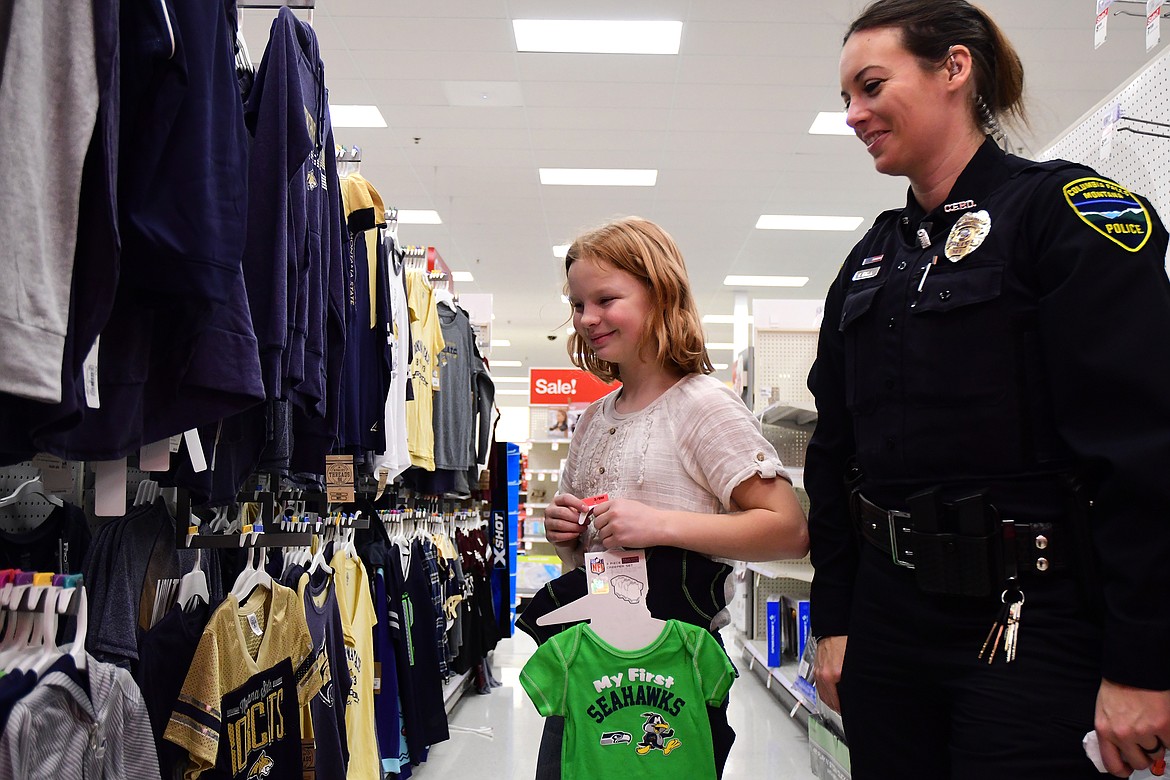 Officer Christine Herman and Tracy Hagadone shop for clothes. (Jeremy Weber photos)