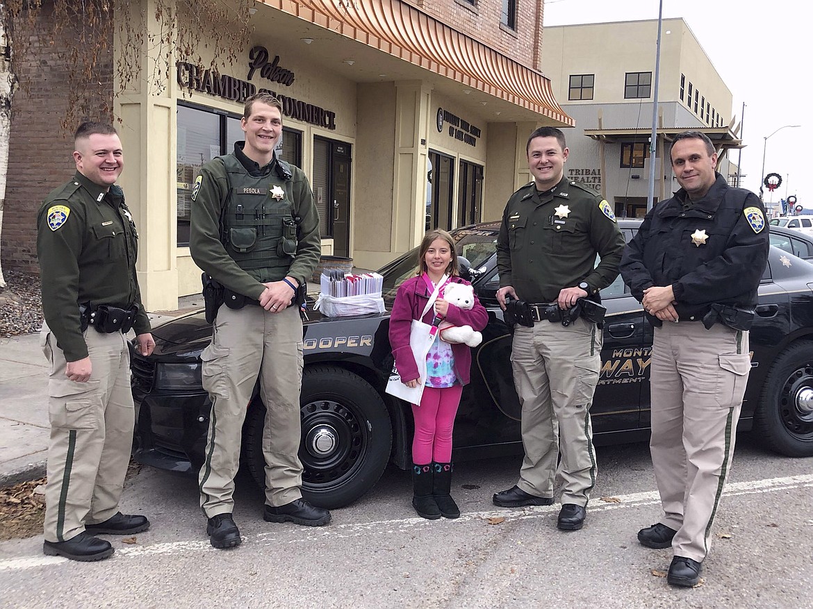 Pictured left to right are Montana Highway Patrol Troopers Wayne Bieber and Noah Pesola, Charlotte Kinnamon, and Troopers Tony Isbell and Jeremy Lee. (Photo courtesy of Cassey Kinnamon)