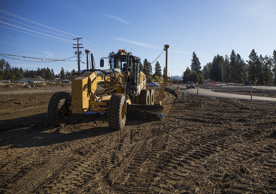 A grader creates a flat surface near the Atlas roundabout on Seltice Way. Other projects this coming year will include traffic improvements in congestion hotspots on Northwest Boulevard, Ironwood and Ramsey Road. (LOREN BENOIT/Press File)