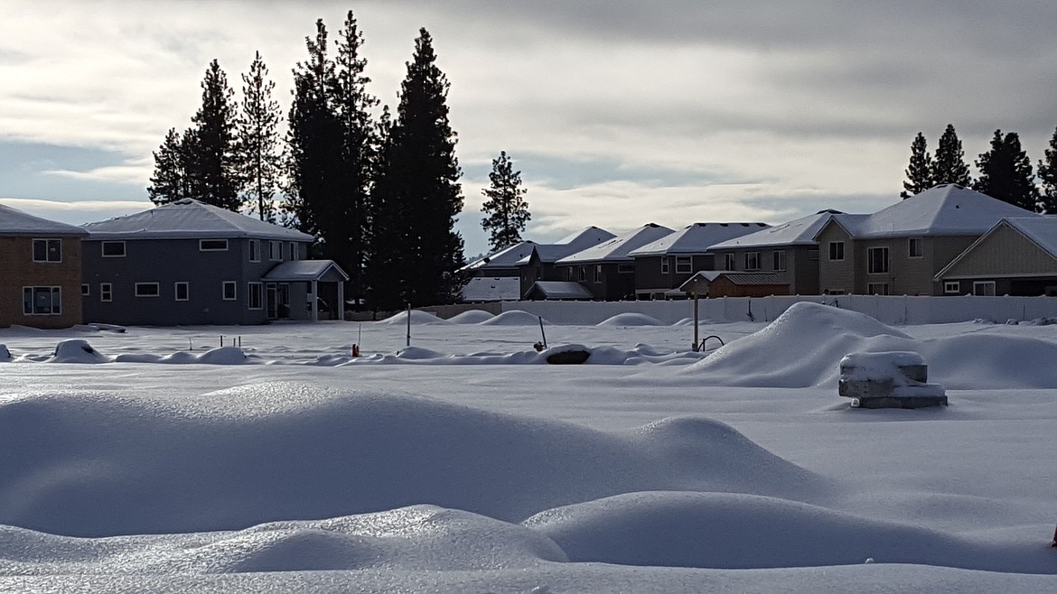 Snow covers a vacant lot in Coeur d&#146;Alene Place.