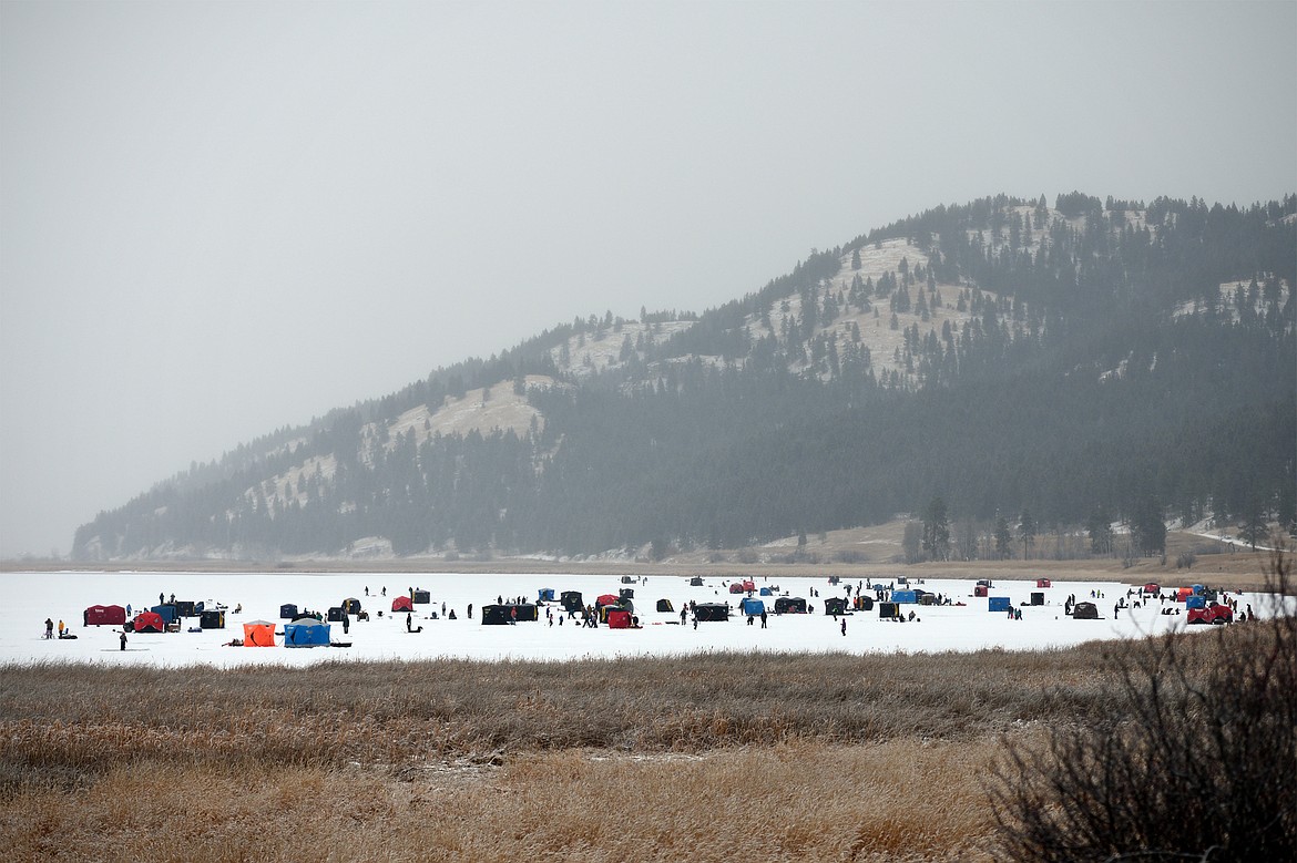 Ice fishing tents and shelters are scattered around Smith Lake at the Sunriser Lions ice fishing derby on Saturday. (Casey Kreider/Daily Inter Lake)