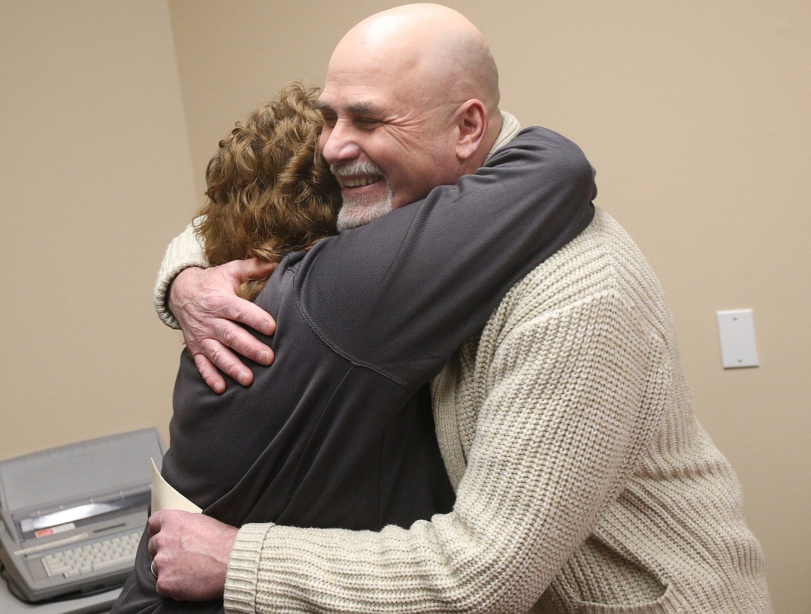 Photos by LOREN BENOIT/Press
Laureen Chaffin with Kootenai County Solid Waste gives Commissioner Bob Bingham a hug during a farewell open house Tuesday for Bingham and fellow Commissioner Marc Eberlein.