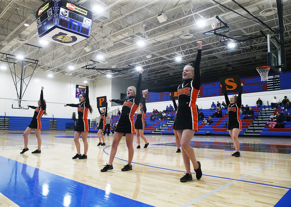 The cheer team from Post Falls High School leads their fans in a cheer during a game Tuesday evening at Viking Court. (LOREN BENOIT/Press)