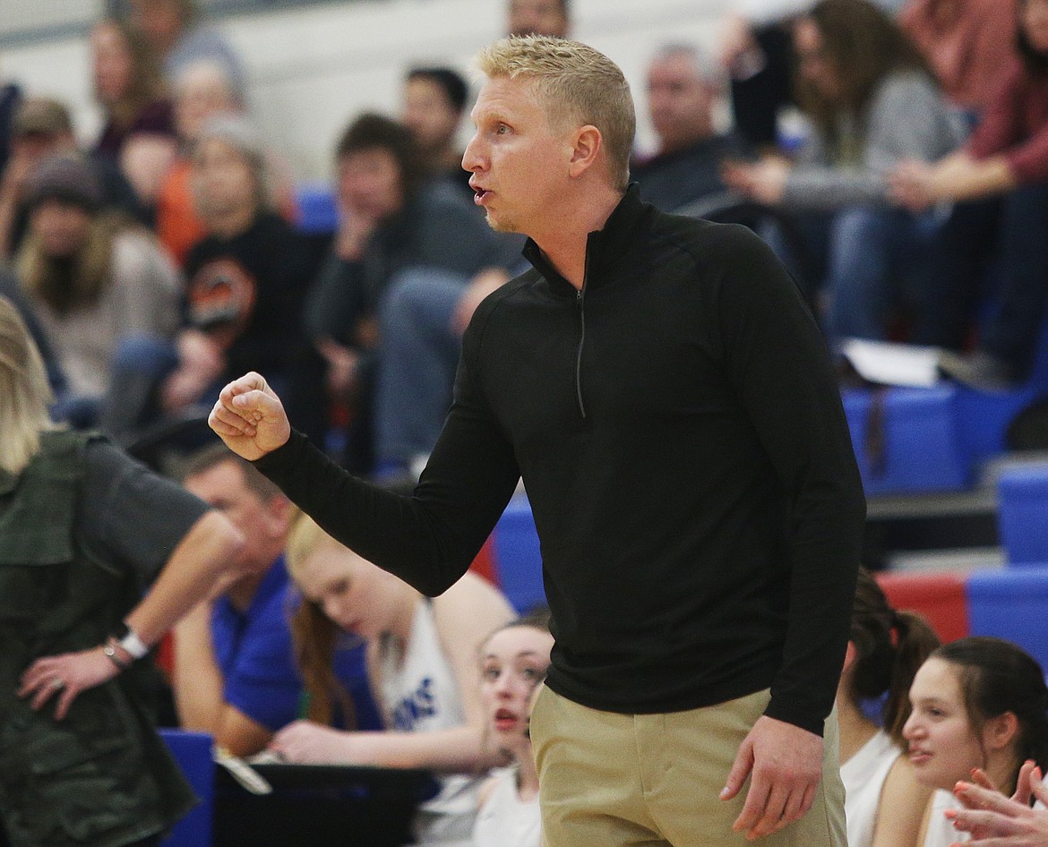 Coeur d&#146;Alene girls varsity head coach Scott Stockwell gives advice to his players during Tuesday night&#146;s game against Post Falls High. (LOREN BENOIT/Press)