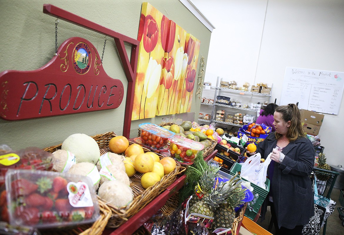 Melissa Scott of Post Falls shops for fresh produce at The Post Falls Food Bank. (LOREN BENOIT/Press)