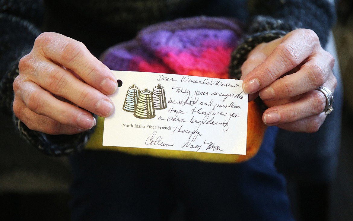 Each volunteer knitter added a personal note of encouragement to go along with a shawl and scarf for a Wounded Warrior. (LOREN BENOIT/Press)
