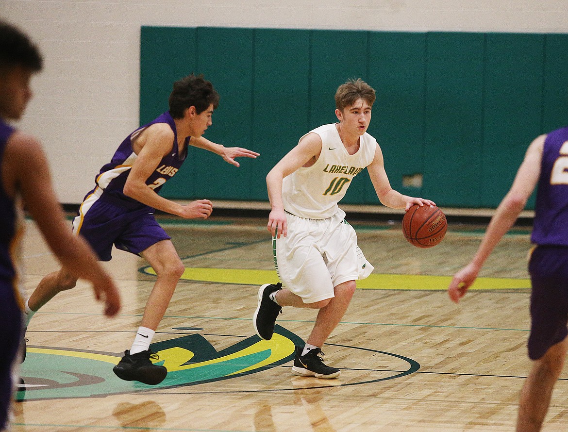 Lakeland&#146;s Carson Seay dribbles the ball down the court during Thursday night&#146;s game against Lewiston. (LOREN BENOIT/Press)