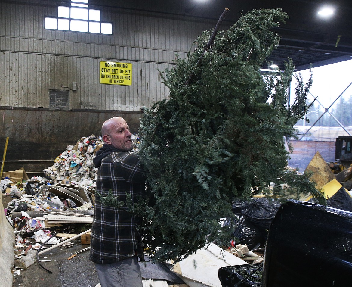 LOREN BENOIT/Press
Rick Harnes drops off his family&#146;s Christmas tree Thursday afternoon at the Ramsey Road transfer station. The transfer station expects to see large amounts of trees throughout the next week.