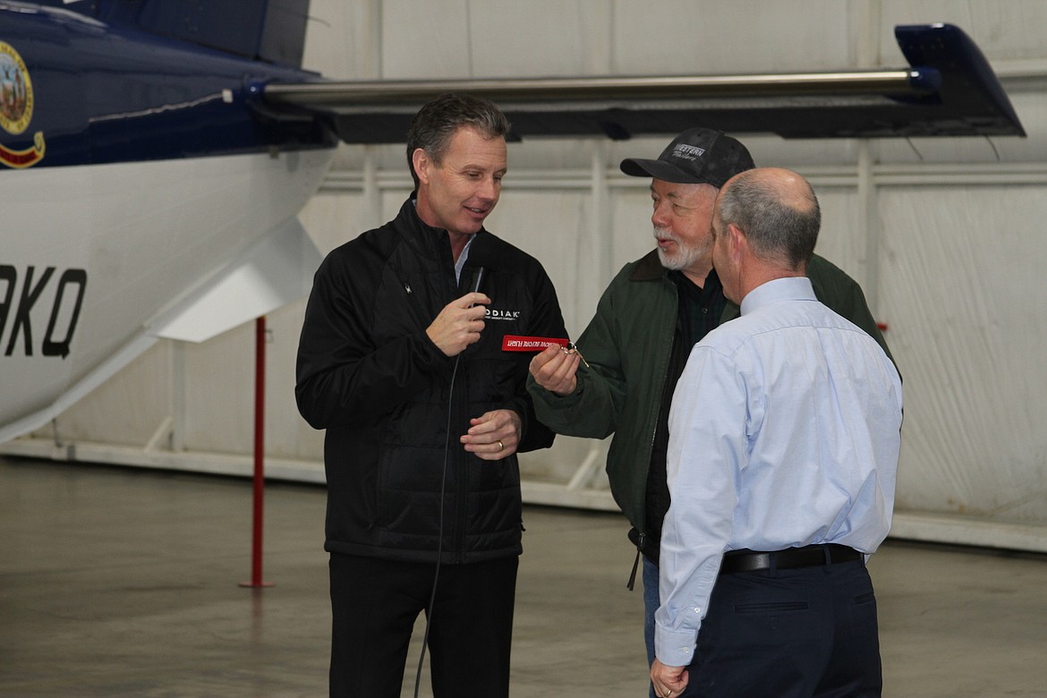 (Photo by KEITH KINNAIRD)
Jonathan Payne, Quest Aircraft Co.&#146;s senior vice president of sales and marketing, hands off the key to a Kodiak 100 to Idaho Transportation Board Chairman Jerry Whitehead while Mike Pape, administrator of the Idaho Transportation Department&#146;s Division of Aeronautics looks on.