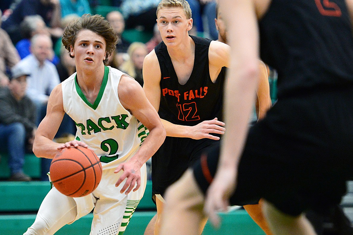 Glacier's Drew Deck (2) brings the ball upcourt against Post Falls at Glacier High School on Friday. (Casey Kreider/Daily Inter Lake)