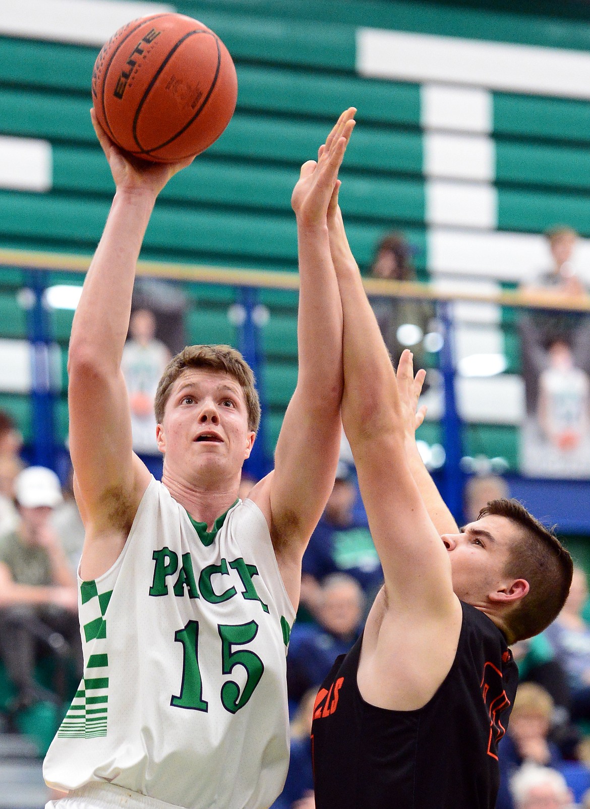 Glacier's Drew Engellant (15) drives to the hoop with Post Falls' Josiah Shields (21) defending at Glacier High School on Friday. (Casey Kreider/Daily Inter Lake)