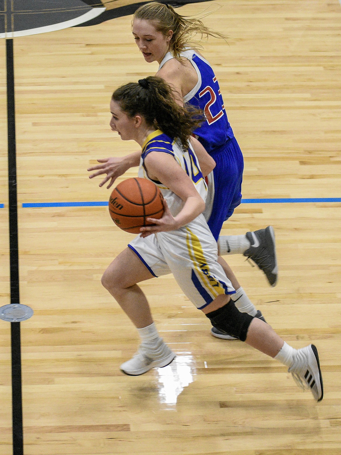 Libby senior Emma Gruber drives down court to shoot for three after picking up the rebound during the third quarter Friday. (Ben Kibbey/The Western News)