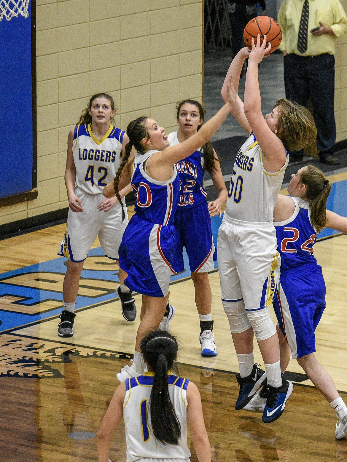 Libby sophomore Taylor Holm puts up two in the final seconds against Columbia Falls Friday. (Ben Kibbey/The Western News)