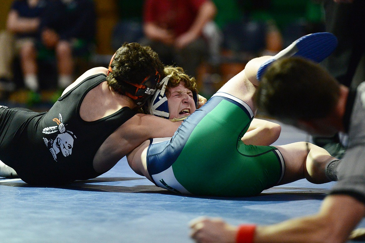 Flathead's Dominic Battello works toward a pin against Glacier's Kael Willis at 138 lbs. during a crosstown matchup at Glacier High School on Thursday. (Casey Kreider/Daily Inter Lake)