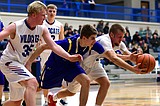 Kats roll in blowout wins, boys drop two