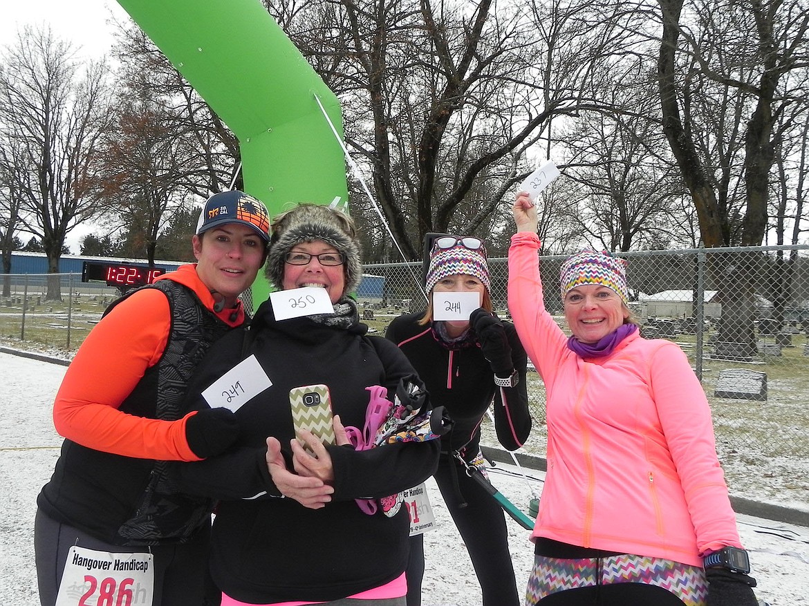 Brina Carrigan, Marty Hunter, Sandra Graf, and Debbie Medlen celebrate at the finish line of the Hangover Handicap on Tuesday morning. (Courtesy)