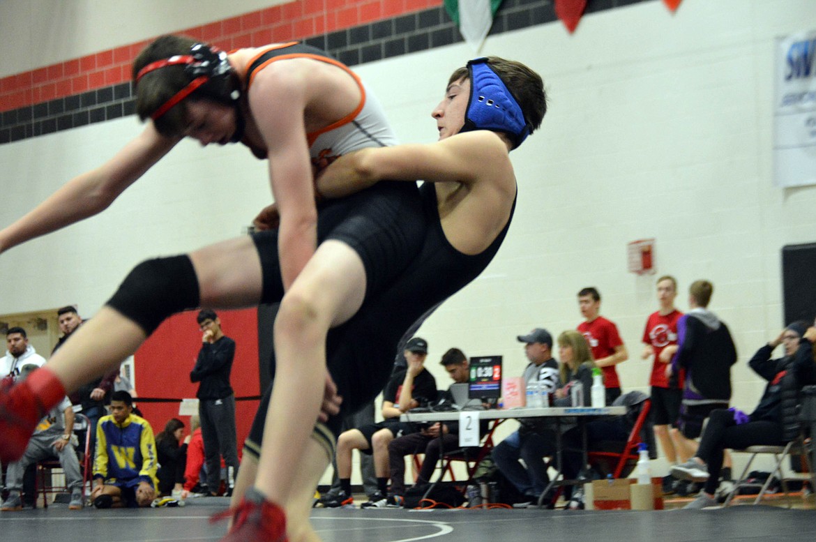 Dakota Eixenberger sets up to throw his opponent during a match at the Blackhawk Invite in Cheney. Eixenberger took second place at 106 pounds.