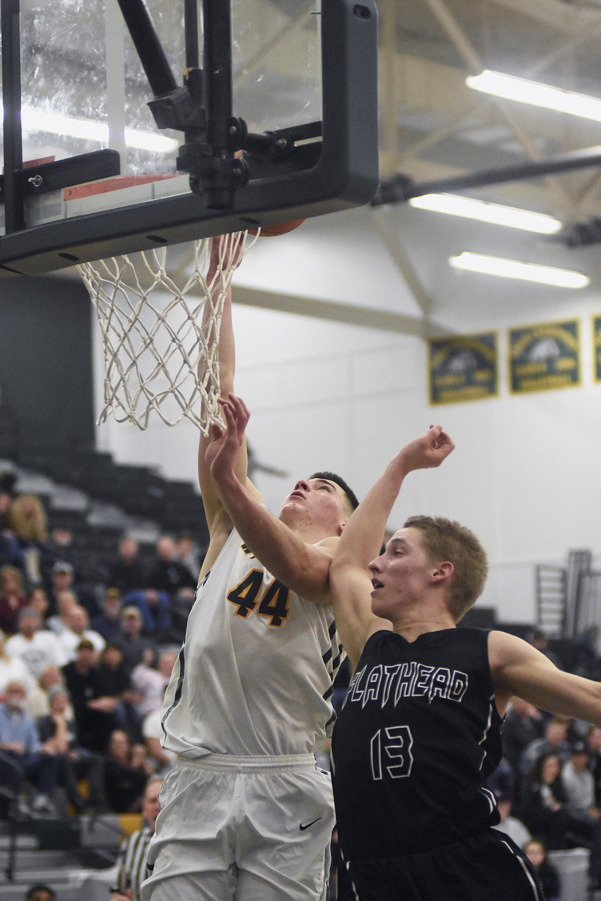 Lee Walburn lays it in over a Braves defender during Friday's 59-51 win over Flathead. (Daniel McKay/Whitefish Pilot)