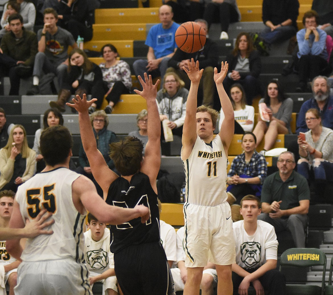 Mark Anderson nets three of his 14 points during Friday&#146;s 59-51 win over Flathead. (Daniel McKay/Whitefish Pilot)