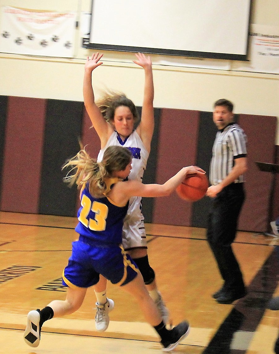 Clark Fork&#146;s Madison Mask is in perfect position to halt a Victor player during a Jan. 3 game. The Lady Cats won over the Lady Pirate,s 38-16 in Alberton. (Photo courtesy of Nick Turnbull)