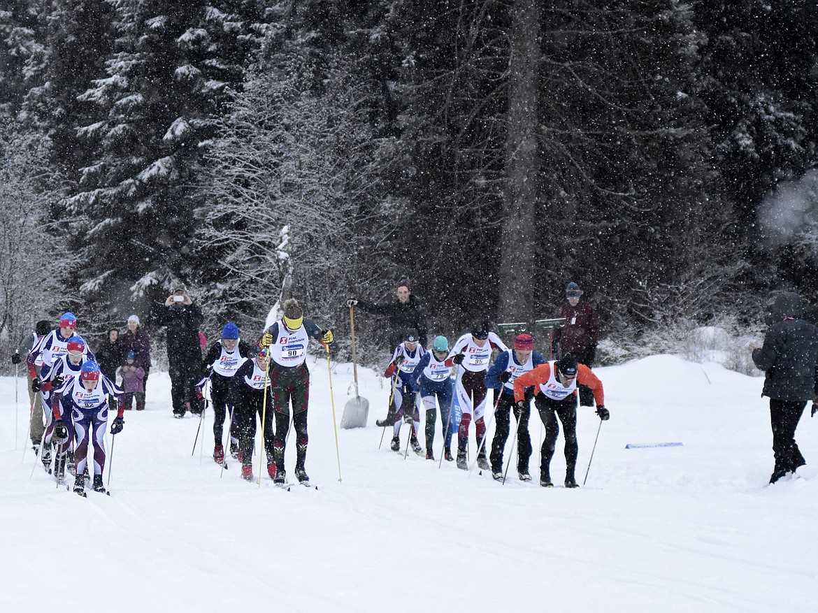 Racers take off from the start line in the 10K classic at the annual Glacier Glide on Sunday at the Dog Creek Lodge and Nordic Center in Olney. (Heidi Desch/Whitefish Pilot)
