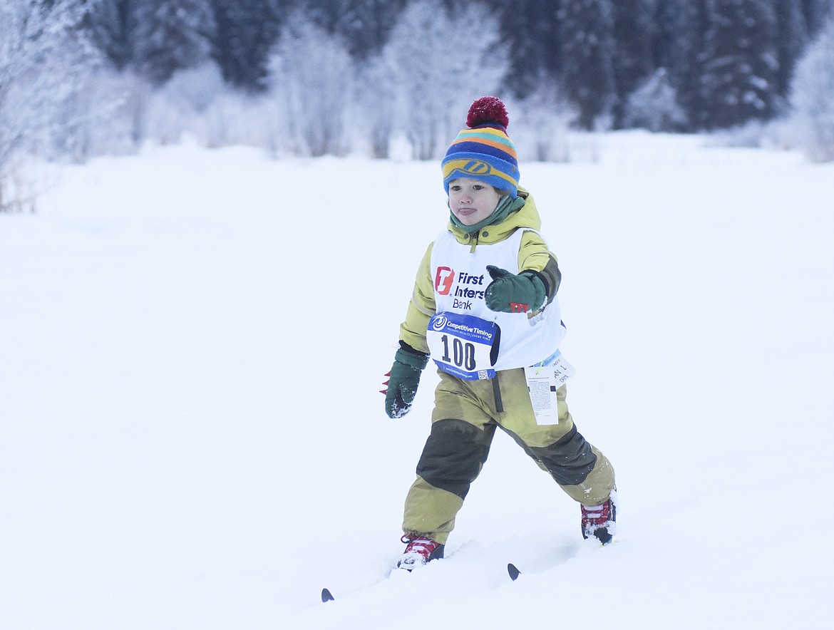 Henry Radley, 4 of Missoula, warms up before the races at the annual Glacier Glide on Sunday at the Dog Creek Lodge and Nordic Center in Olney. (Heidi Desch/Whitefish Pilot)