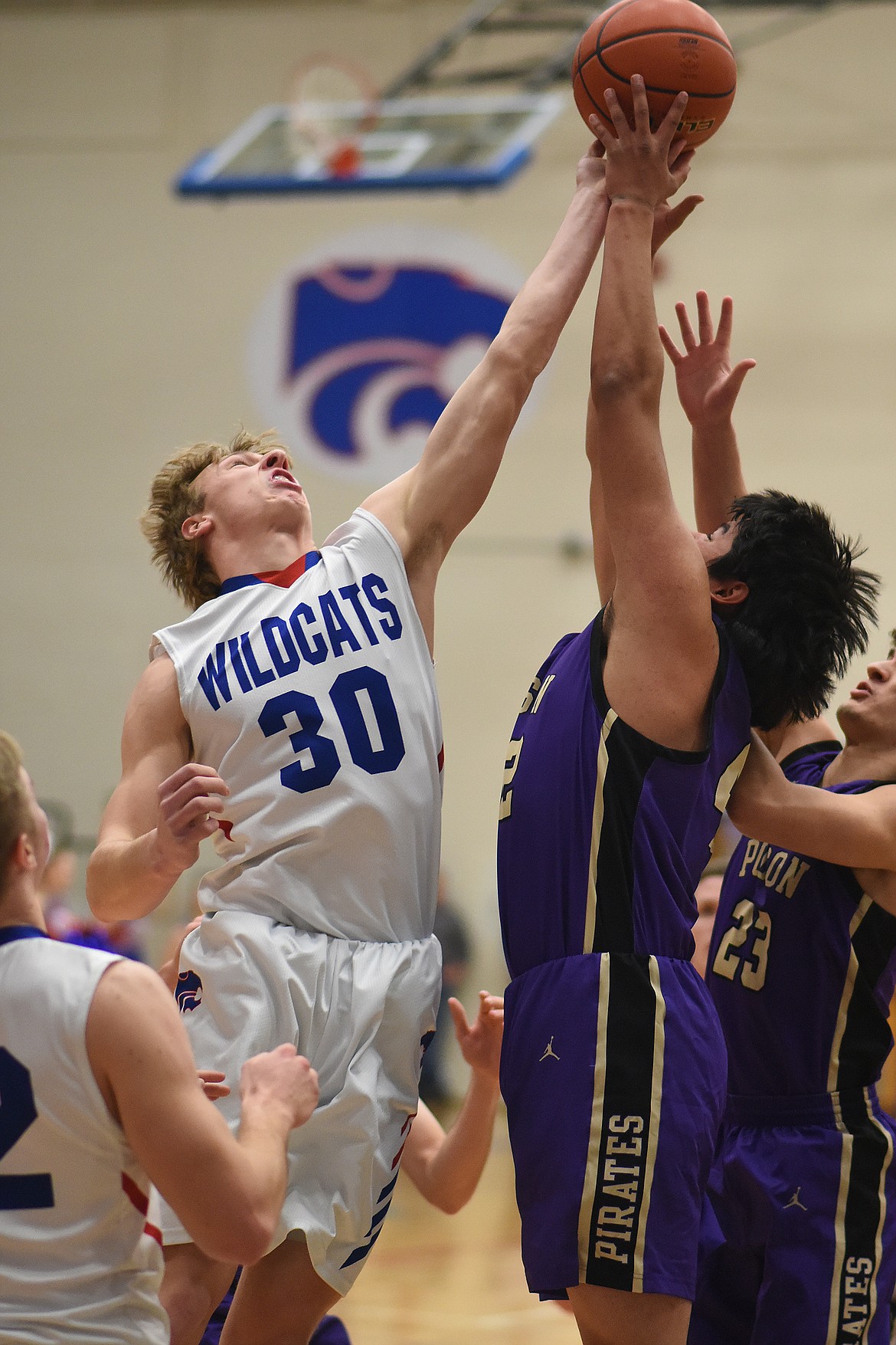 Zach Pletcher (30) fights for the loose ball against Polson in the first half Saturday. (Chris Peterson photo)