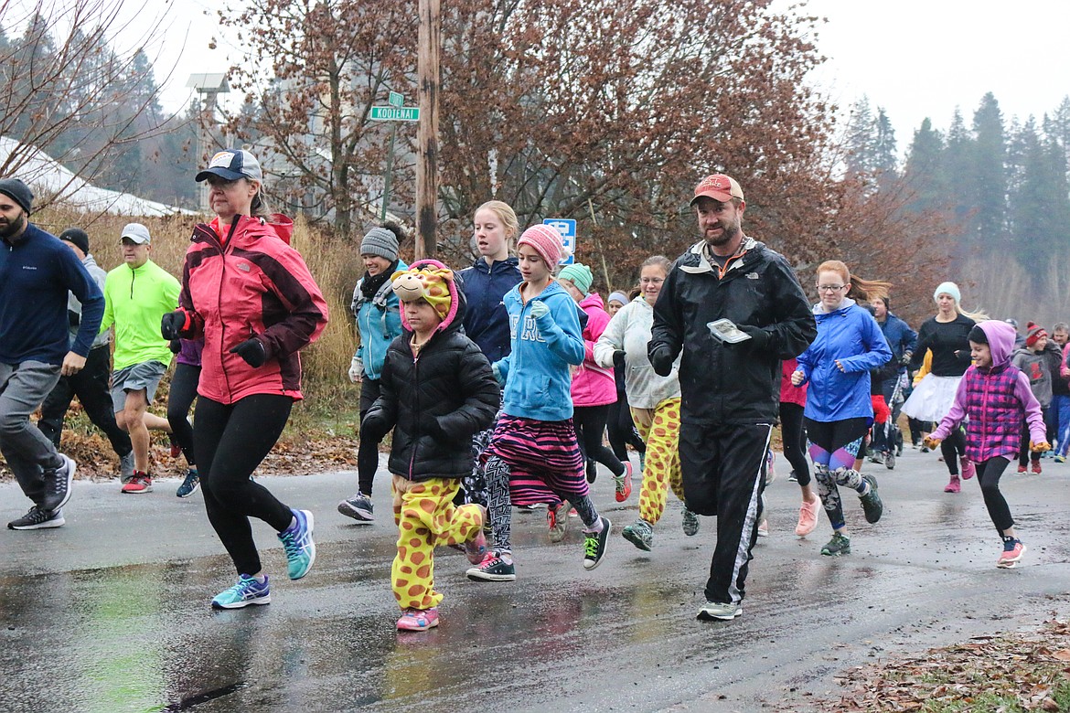 Photo by MANDI BATEMANDespite a cold, rainy day, record numbers showed up to participate in the annual Turkey Trot on Thanksgiving.