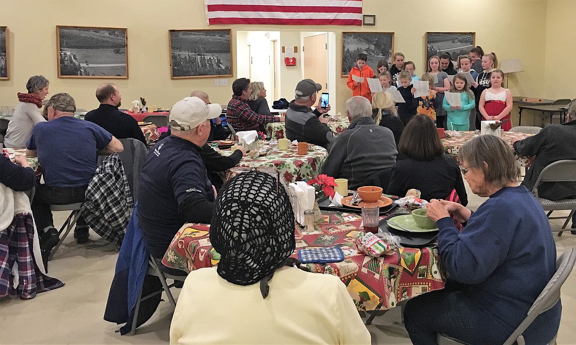 Members of the St. Regis 4-H group sing Christmas songs to seniors in St. Regis on Dec. 14. (Photo courtesy of St. Regis 4-H)