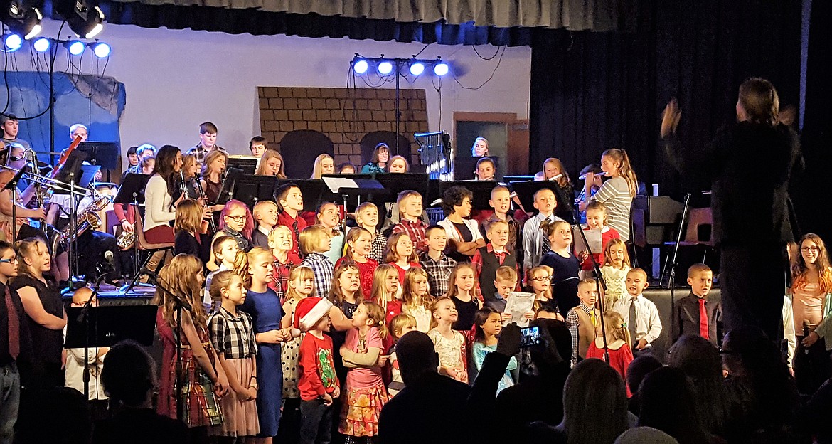 St. Regis students sing &#147;Carol of the Bells&#148; during the annual Winter Concert on Dec. 18, directed by music teacher Derek Larson. (Photo courtesy of Joe Steele)