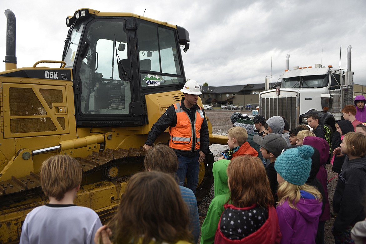 Ryan Dunn of Martel Construction fields questions from third graders at Muldown Elementary School during a tour of the new Muldown&#146;s construction site. The tour came as part of Construction Week, hosted by the Montana Contractors Association and the Office of Public Instruction.