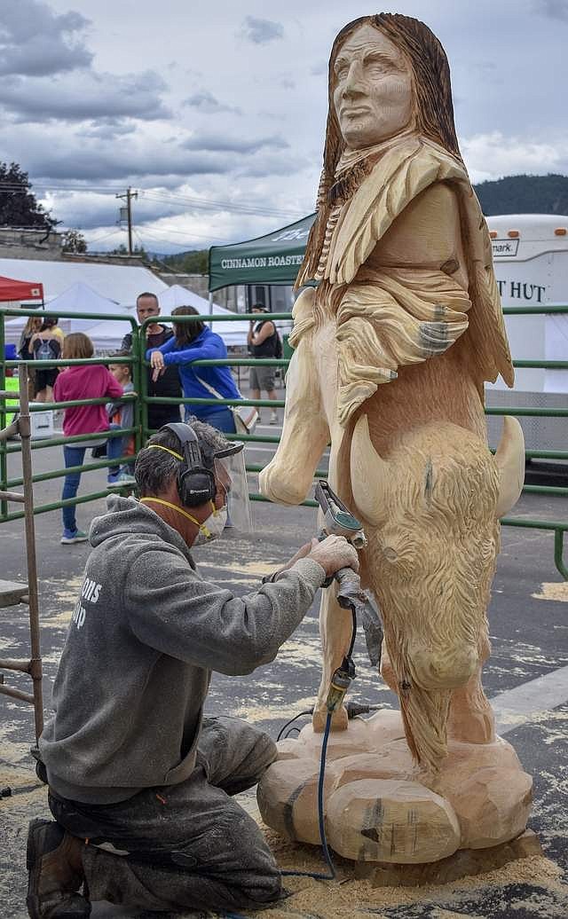 Peoples&#146; Choice Award winner Toman Vrba, from Slovakia, uses a belt sander on his award-winning piece during the Kootenai Country Montana Chainsaw Carving Championship, Sept. 22. (Ben Kibbey/The Western News)