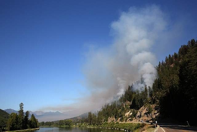 Smoke from a 12-acre burn out operation performed on the Highway 37 fire rises Tuesday morning. (John Blodgett/The Western News)
