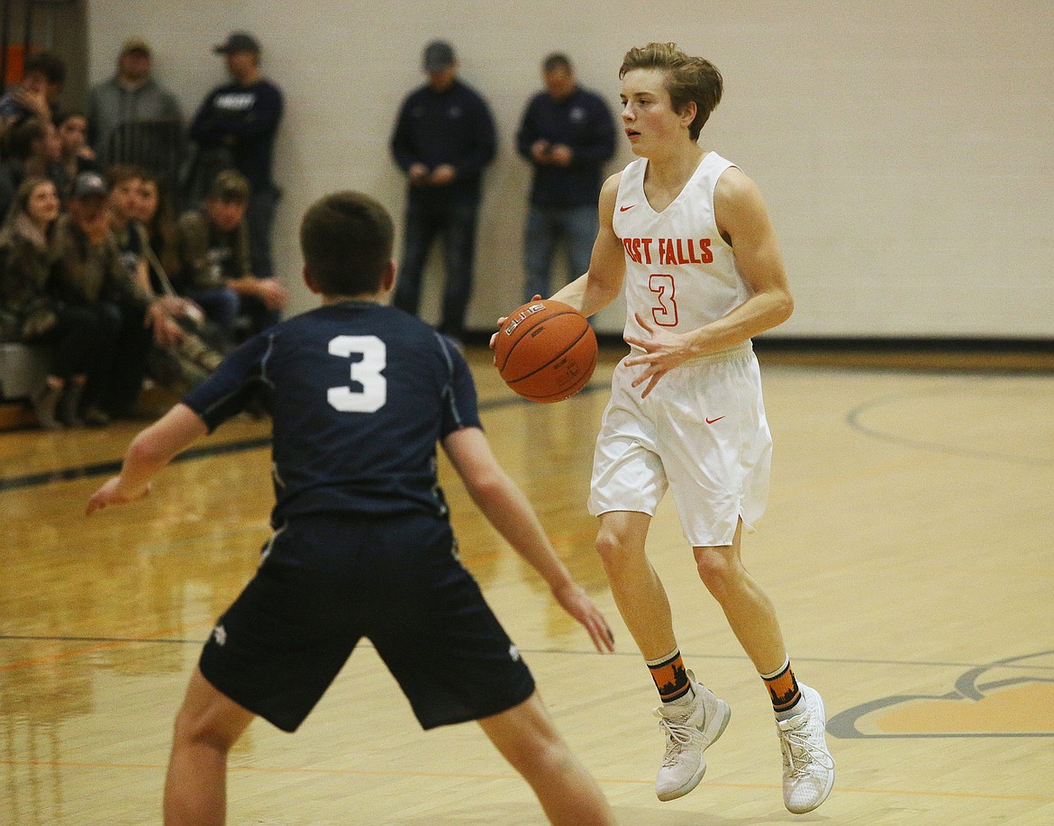 Post Falls guard Caden McLean dribbles the ball down the court in Tuesday night's game against Lake City. (LOREN BENOIT/Press)