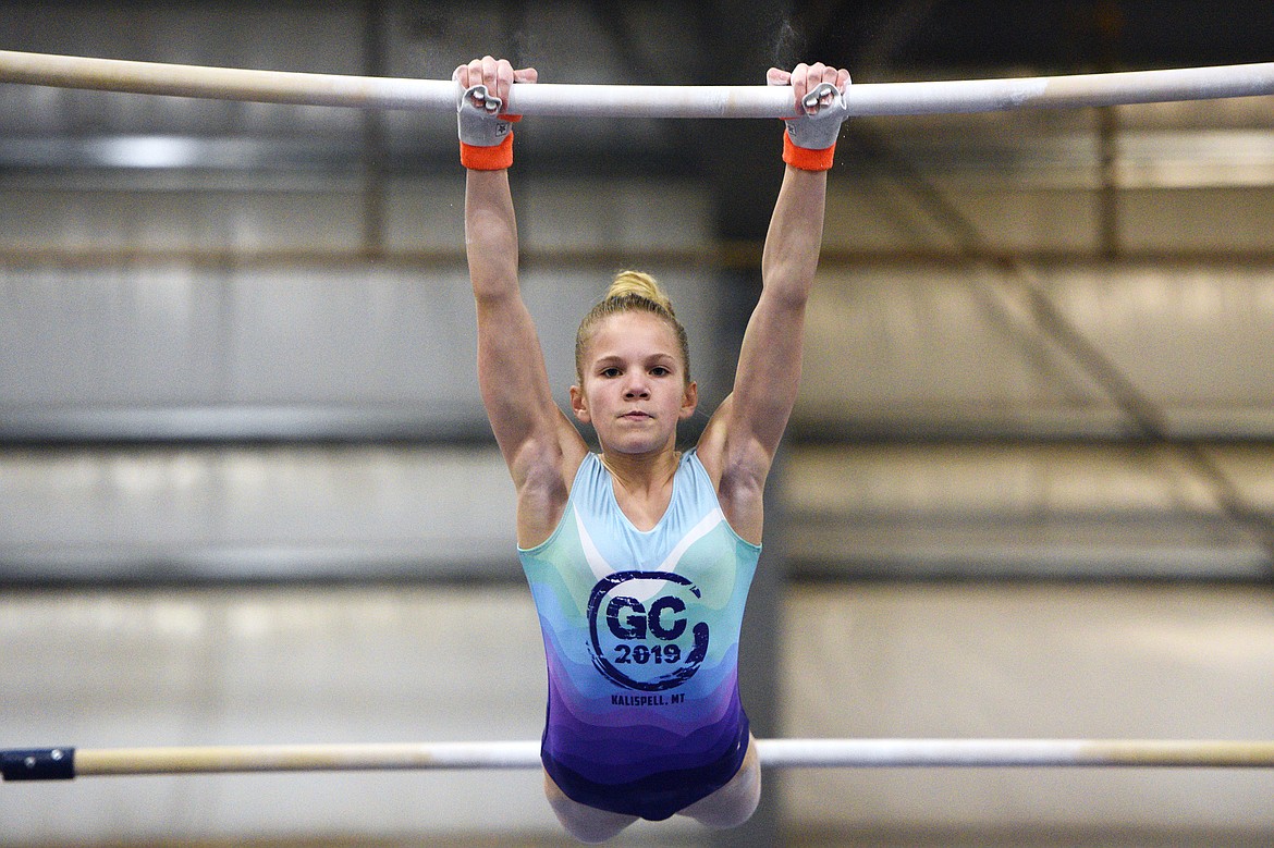 Emma Pate, from Flathead Gymnastics Academy, competes on the uneven bars at the 4th annual Glacier Challenge at the Flathead County Fairgrounds Trade Center in Kalispell on Saturday. (Casey Kreider/Daily Inter Lake)