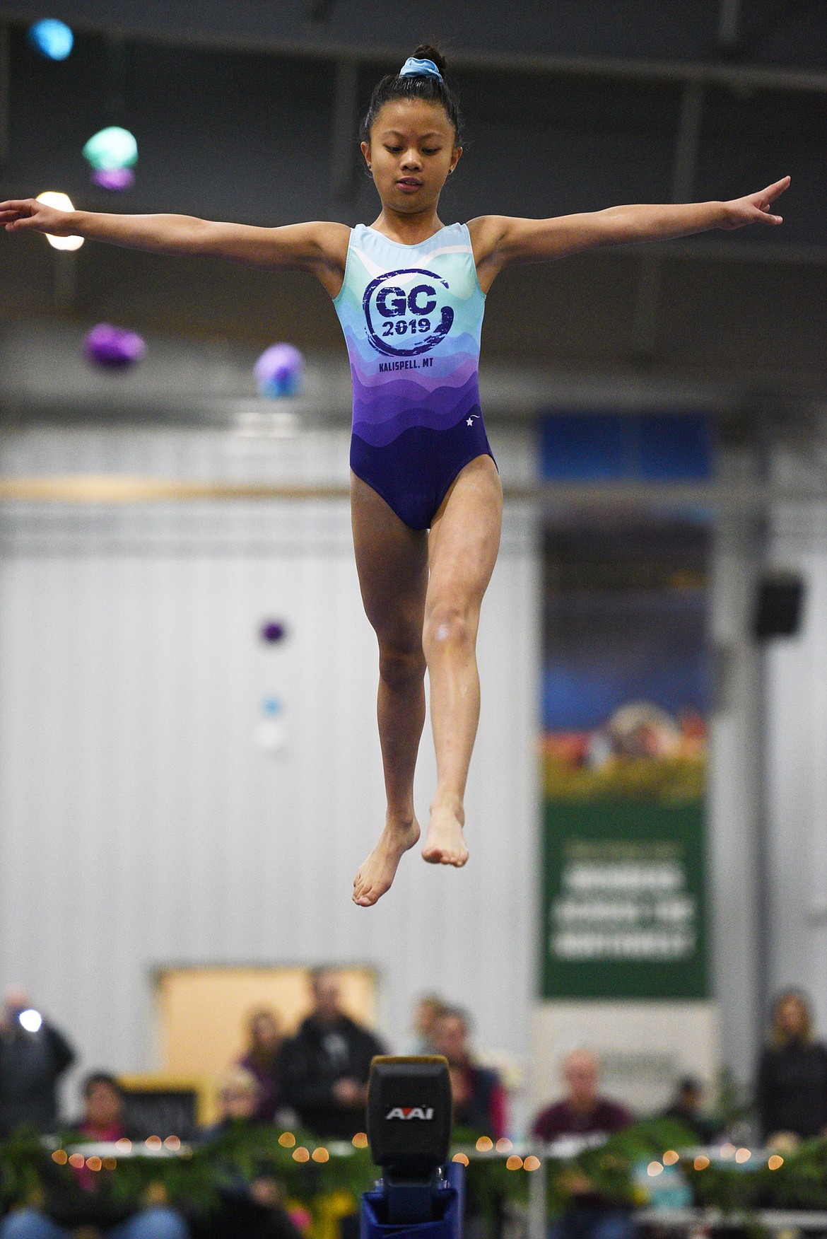 Kaitleen To, from Flathead Gymnastics Academy, competes on the balance beam at the 4th annual Glacier Challenge at the Flathead County Fairgrounds Trade Center in Kalispell on Saturday. (Casey Kreider/Daily Inter Lake)