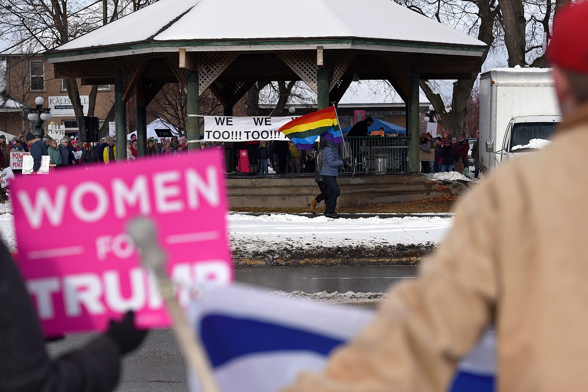 Attendees of a rally in support of President Donald Trump hold signs along East Center Street, across the street from the Kalispell Women's March held at Depot Park in Kalispell on Saturday. (Casey Kreider/Daily Inter Lake)