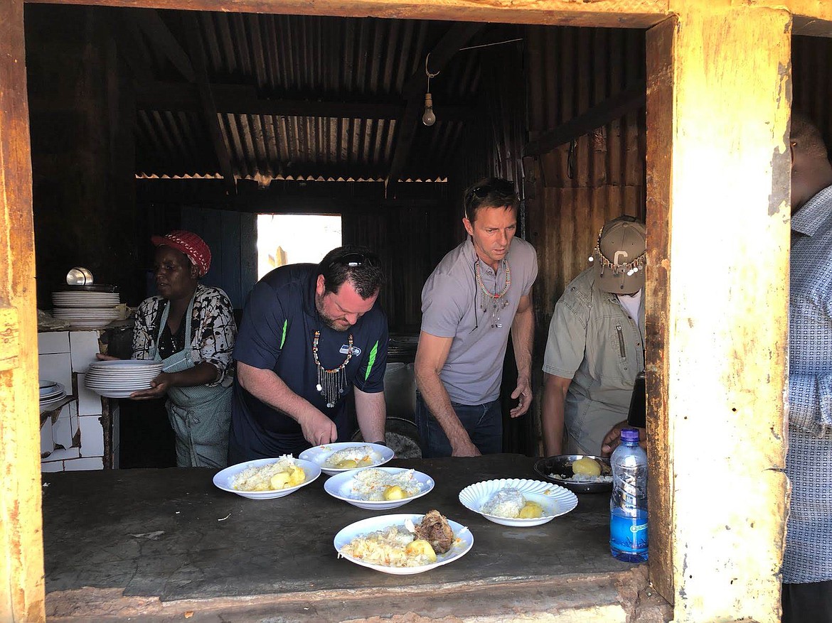 Canvas Church Pastor Kevin Geer prepares meals in a village in Kenya last January. (Photos courtesy of Kevin Geer)