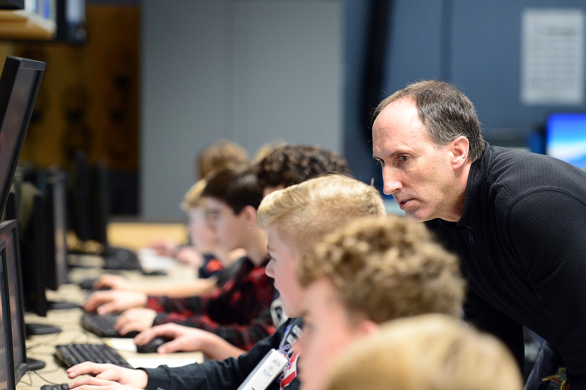 Teacher Mark Drew answers a question from a student in his Introduction to Engineering Design class at Glacier High School on Wednesday, Jan. 9. (Casey Kreider/Daily Inter Lake)