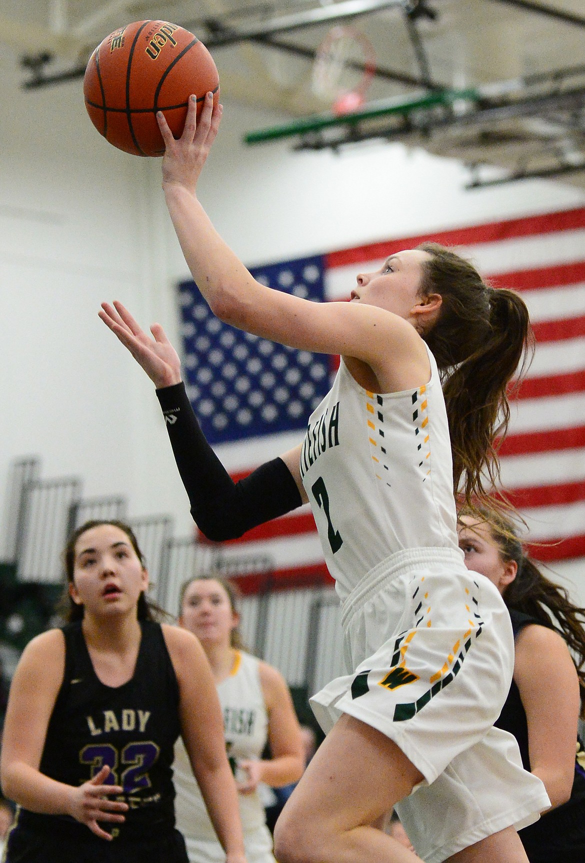 Whitefish's Kaiah Moore (2) heads to the basket against Polson at Whitefish High School on Friday. (Casey Kreider/Daily Inter Lake)