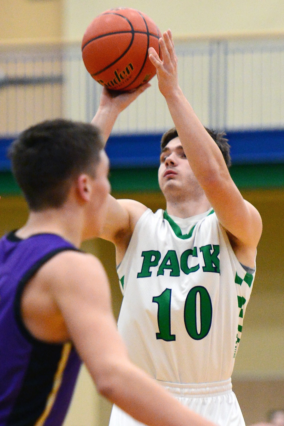 Glacier's K.J. Johnson (10) eyes up a three-pointer against Polson at Glacier High School on Thursday. (Casey Kreider/Daily Inter Lake)