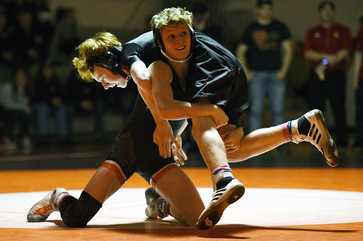 Flathead's Cole Eastwood wrestles Missoula Hellgate's Jacob Hickman at 113 lbs. at Flathead High School on Thursday. Eastwood won by pin. (Casey Kreider/Daily Inter Lake)